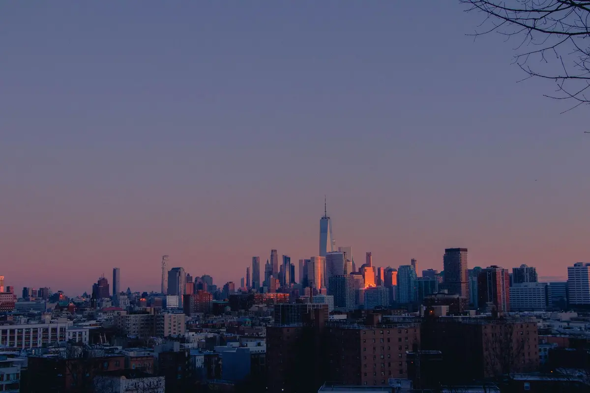 A stunning cityscape at twilight showcasing modern skyscrapers and urban architecture.